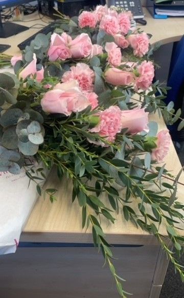 The bride chose beautiful pink roses with eucalyptus.