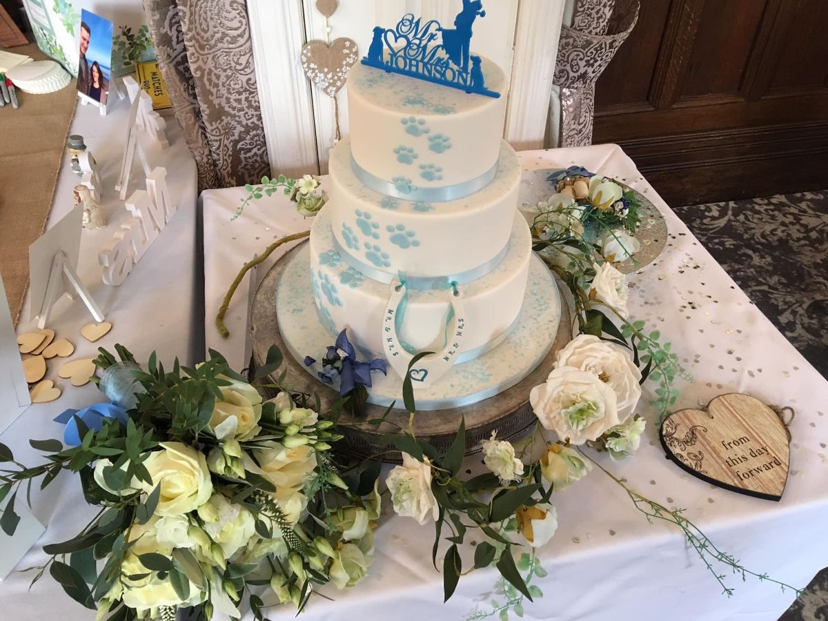 A very tasty 3 storey cake to tie in with the icy blue theme and the love for their dogs.