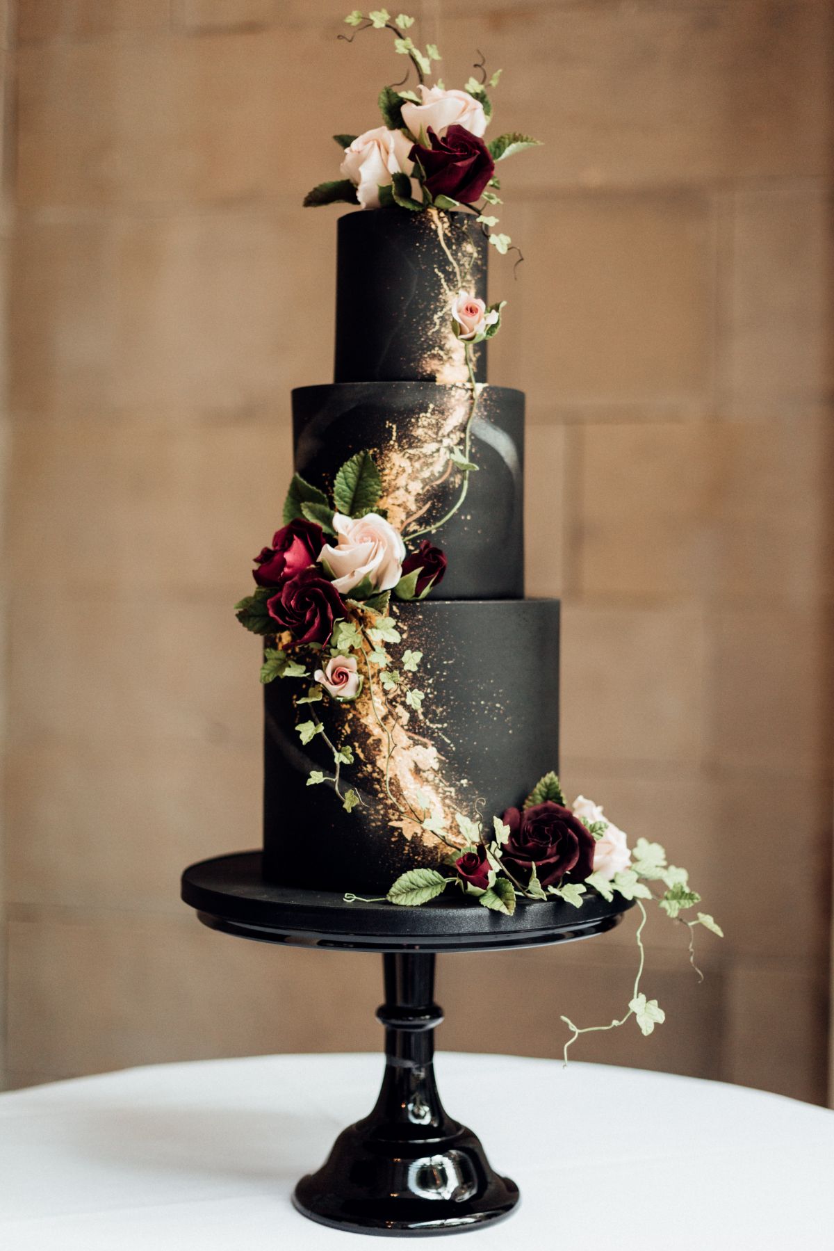 @benthecakeman's incredible black wedding cake - yes those are real sugar flowers!