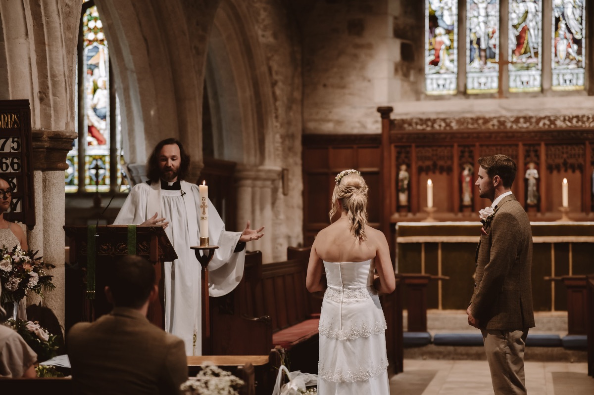 Couple paying attention to the Gospel